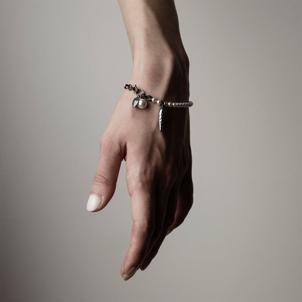 Pearl & Shell Bracelet - on a woman's wrist, general fit and dimensions of the shell charms are visible