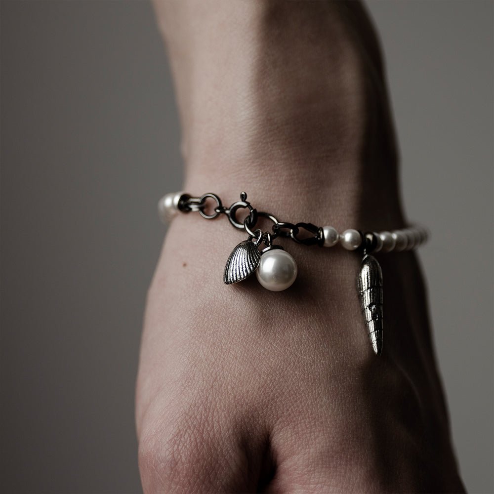 Pearl & Shell Bracelet - on a wrist, close up of lobster clasp and shell charms