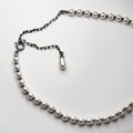 Pearl Choker lying on a white surface