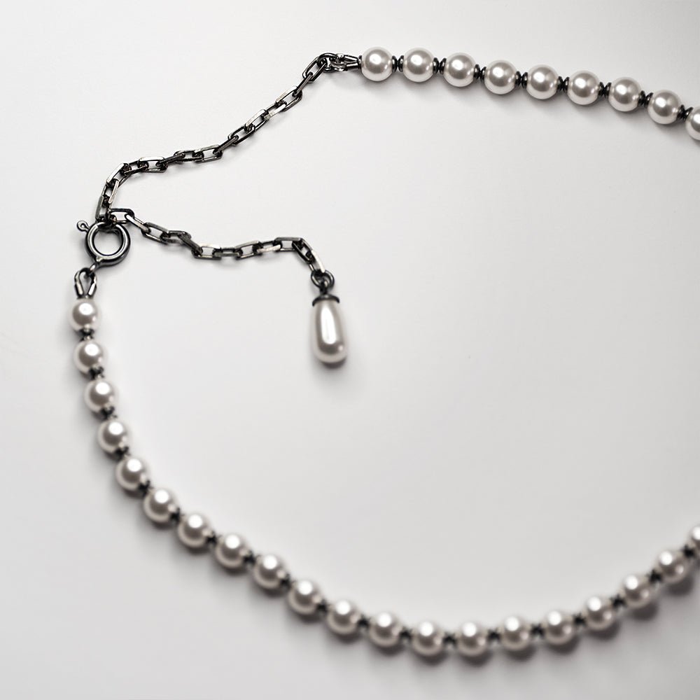 Pearl Choker lying on a white surface