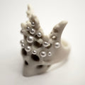 Pearl Crown Skull ring — white marble skull with pearl-tipped crown spires on white surface | Macabre Gadgets