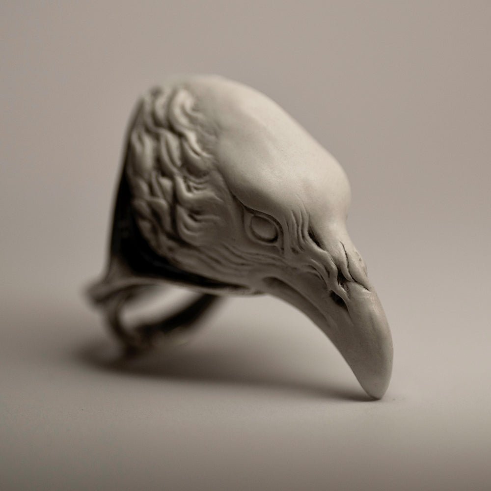 Raven ring - white variant - semi side view, overall palette of the image and the white raven itself gives striking feeling of awe