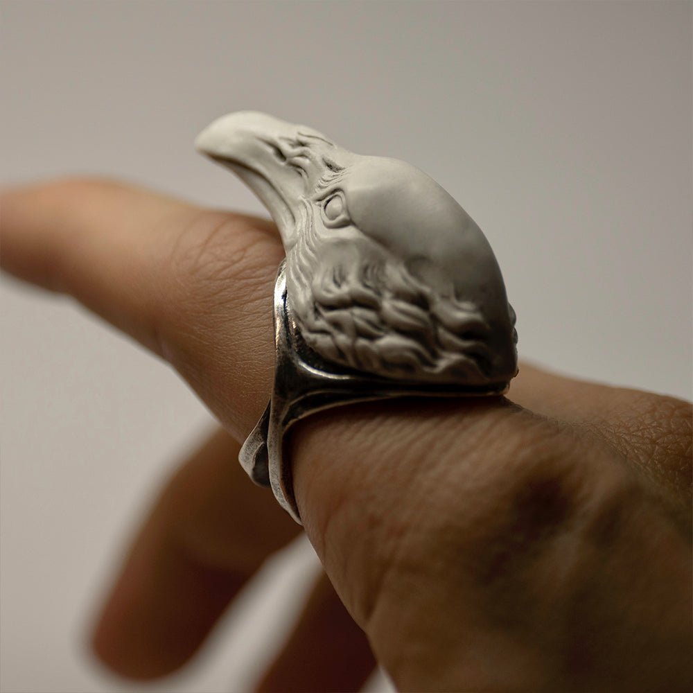 Raven ring - white variant - on a model's hand, close up