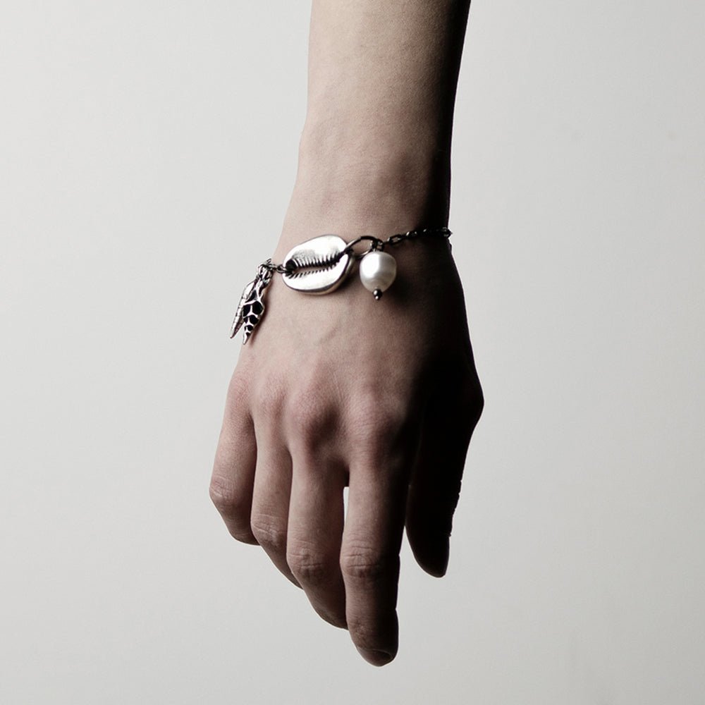 Shell Bracelet on a woman's wrist, to show general fit and dimensions of the sea shell charms