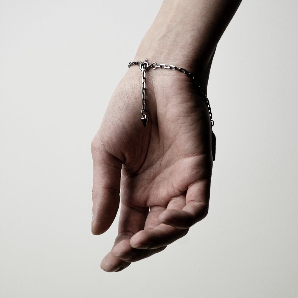 Shell Bracelet on a wrist - back of the hand shown to display a lobster clasp