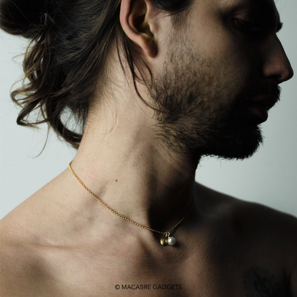 Male model wearing Shell & Pearl pendant - siren core jewelry styling shot