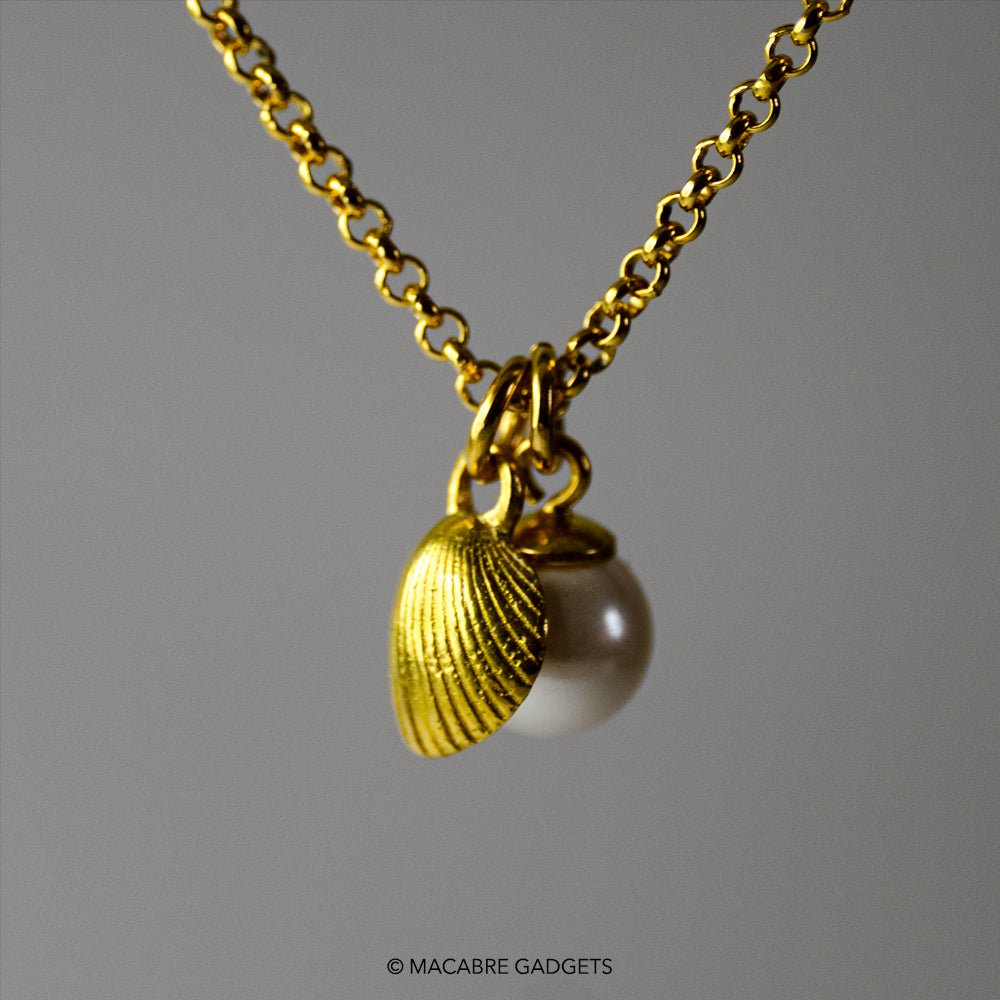 Shell & Pearl pendant - gold variant - mini pendant in shape of a sea-shell and same size pearl on a chain