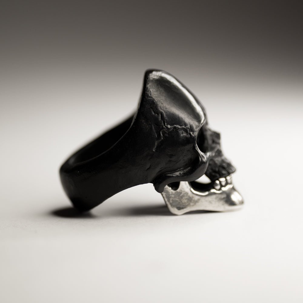 Black Skull ring with a solid sterling silver jaw -  jewelry with a breathtaking contrast of forms and textures