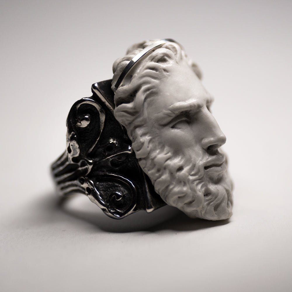 Silver Zeus ring — three-quarter view facing right, hand-sculpted marble face of Zeus on heavy sterling silver Corinthian column band, THEA by Macabre Gadgets