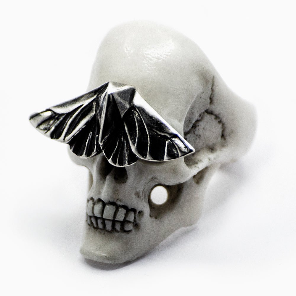 Skull & Moth ring - white variant - semi side view on a white background