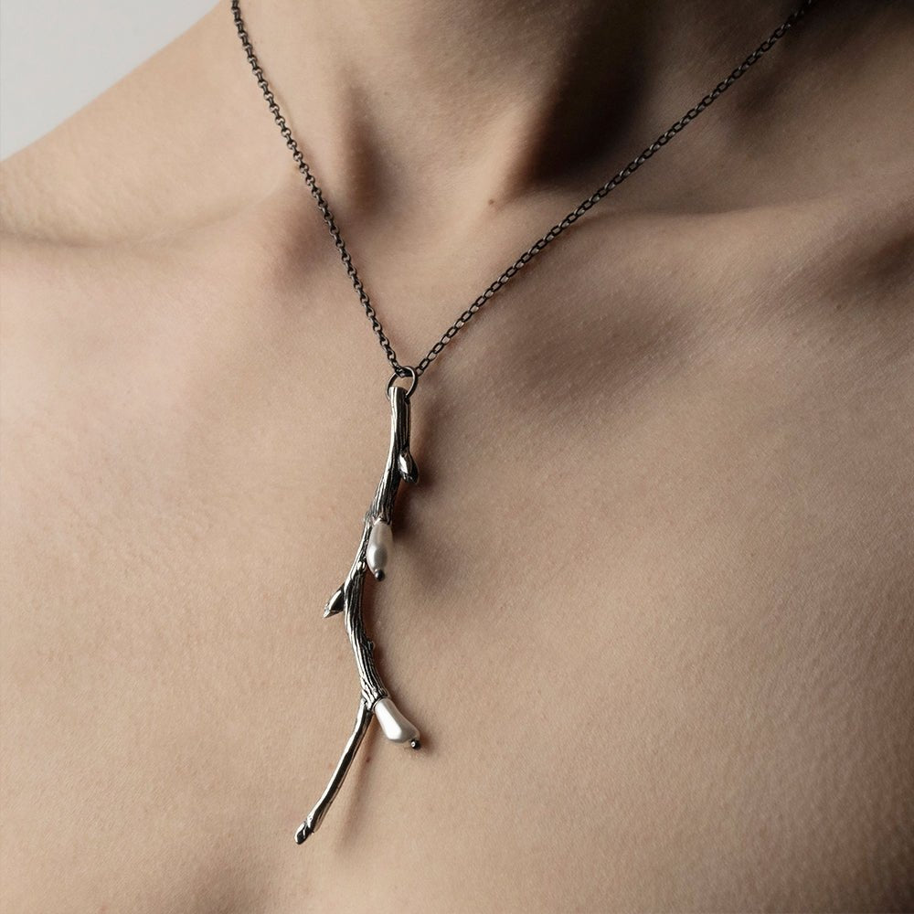 Silver Twig pendant on a model from a different angle