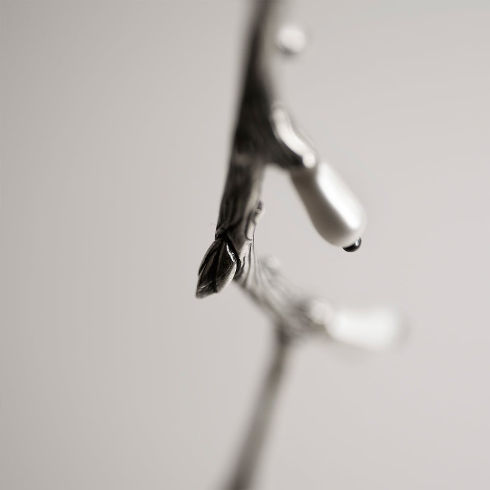Silver Twig pendant close up on a twig details 