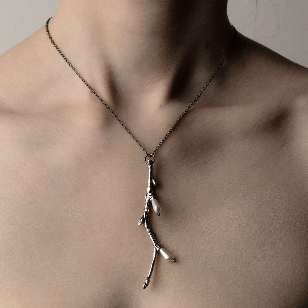 Silver Twig pendant clear product picture on a model