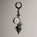 Woods Charm earring - number of charms including miniature bird skull, marble eye relief and natural stone beads on neutral background