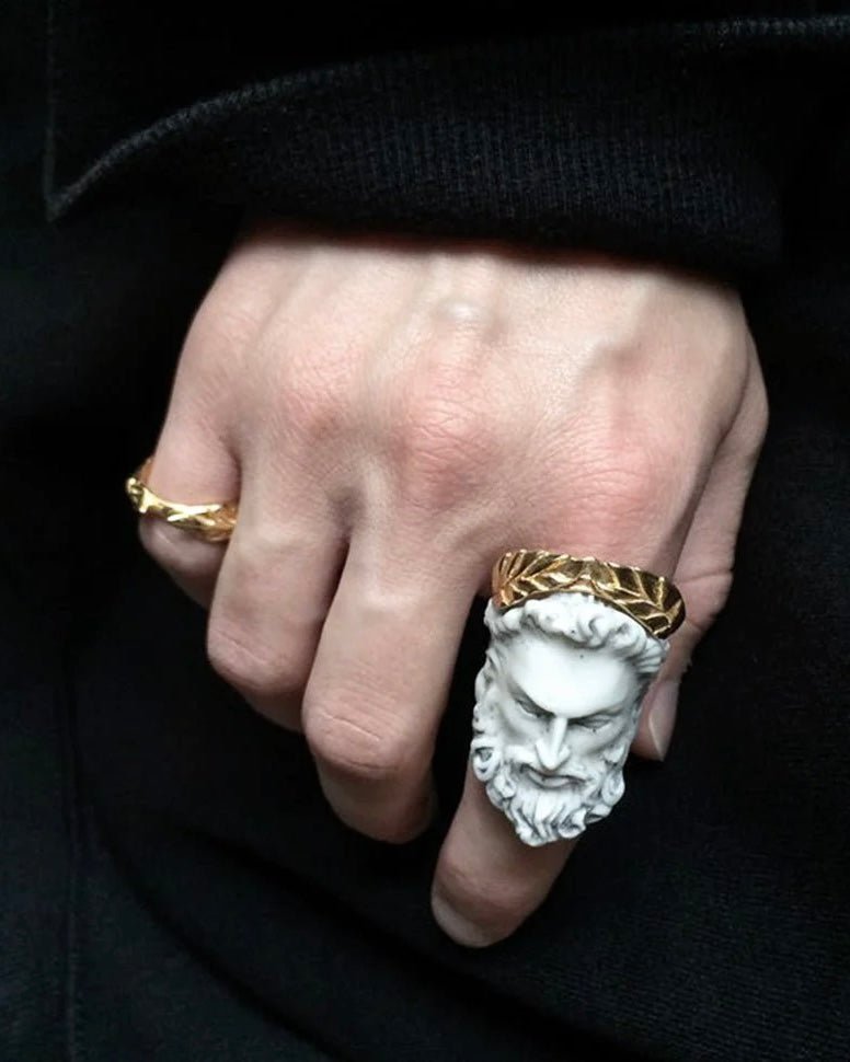 Zeus ring on a male model styled with other ring